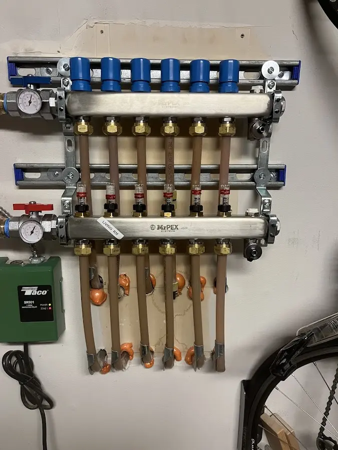 Plumber performing Water Heater Repair at a residential property in Four Corners